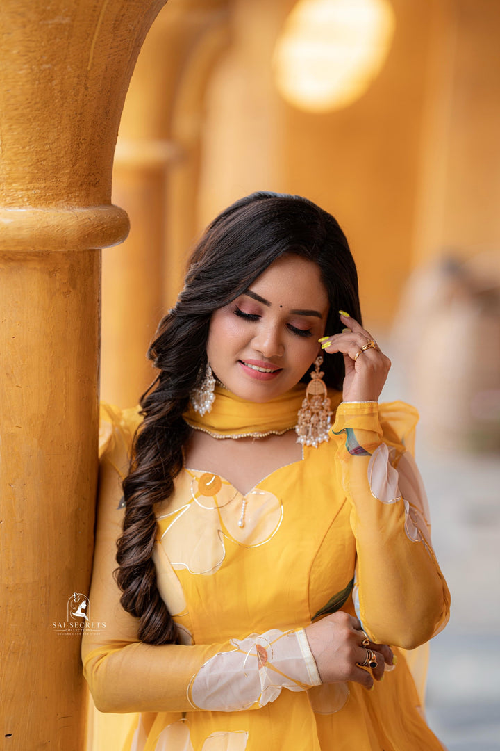 Sai Secrets Collections Women's  Anarkali FOIL PRINTED ORGANZA PAVAZHAMALI - Mango Yellow.