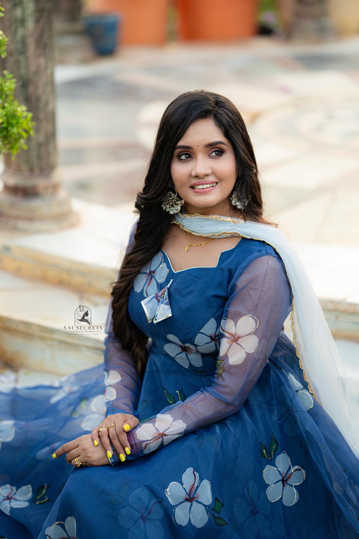 Sai Secrets Collections Women's Anarkali - Pavazhamali  FOIL PRINTED ORGANZA BLUE.